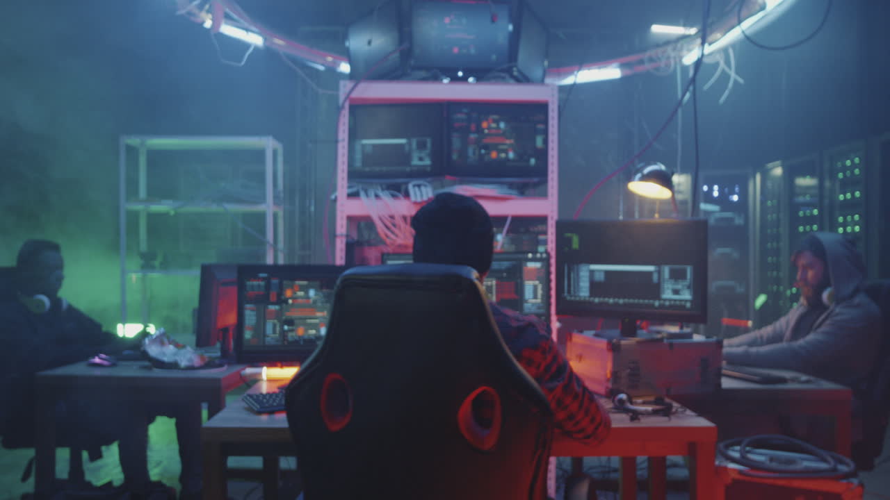 Hacker working in a dark computer room