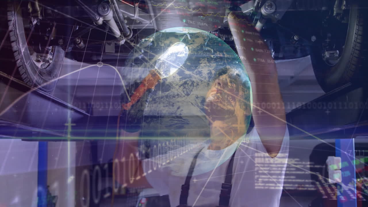 Mechanic repairing car underside in automotive garage, with floating globe, graphs, binary code
