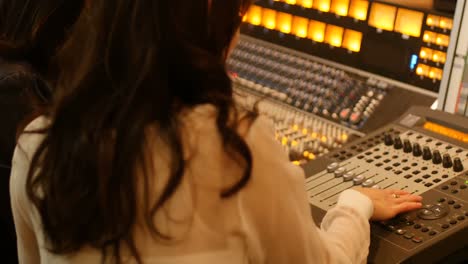 female audio engineers using sound mixer