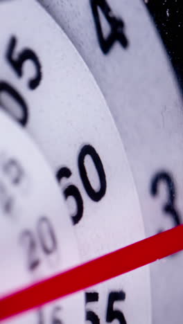 closeup-of-analogue-clock-face-in-vertical