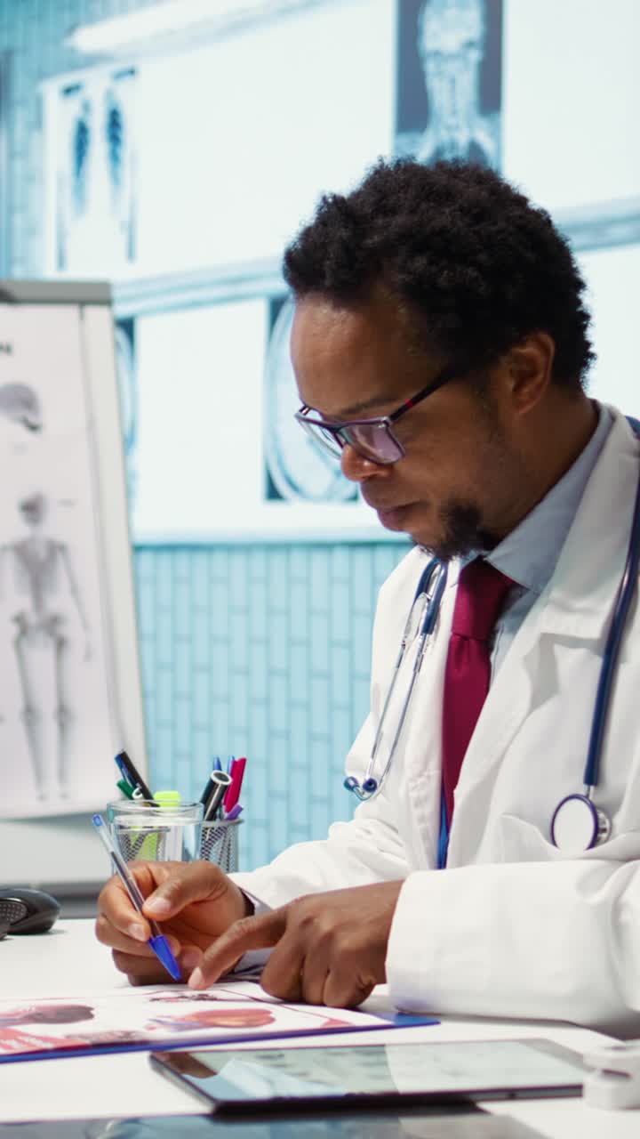Male physician doing an x ray diagnostics scan interpretation during check up