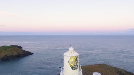 lighthouse on calm morning. drone pass backwards