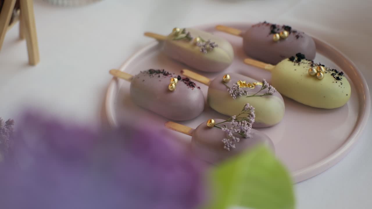 Cake dessert resembling ice cream at a wedding table, cinematic close-up, golden details