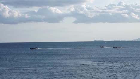 some army ships riding by in the atlantic