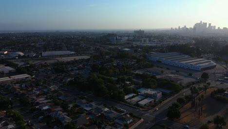 Aerial Drone Panning from Downtown Los Angeles Skyline to Epic Large Hospital building and Residential Area During Spectaular Sunset