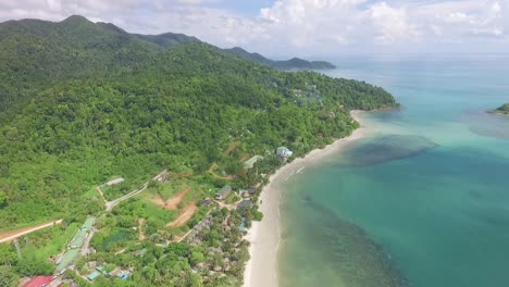 slow rising aerial view above thailand koh chang island colourful scenic resort coastline