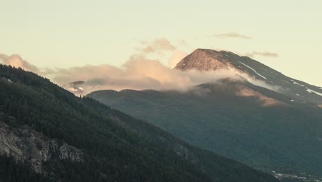 timelapse of a mountain where clouds are passing by