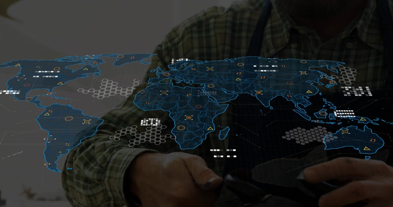 Senior artisan scraping leather edge initiating technology world map graphic animating overhead