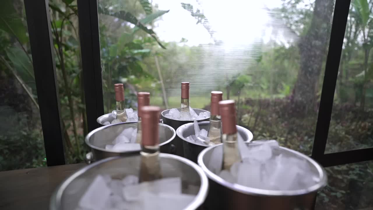 Chilled champagne bottles in ice buckets ready for serving at outdoor event