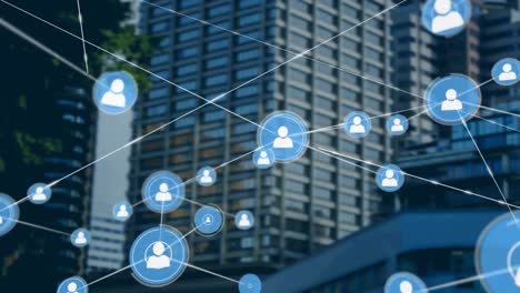 network of profile icons against tall buildings in background
