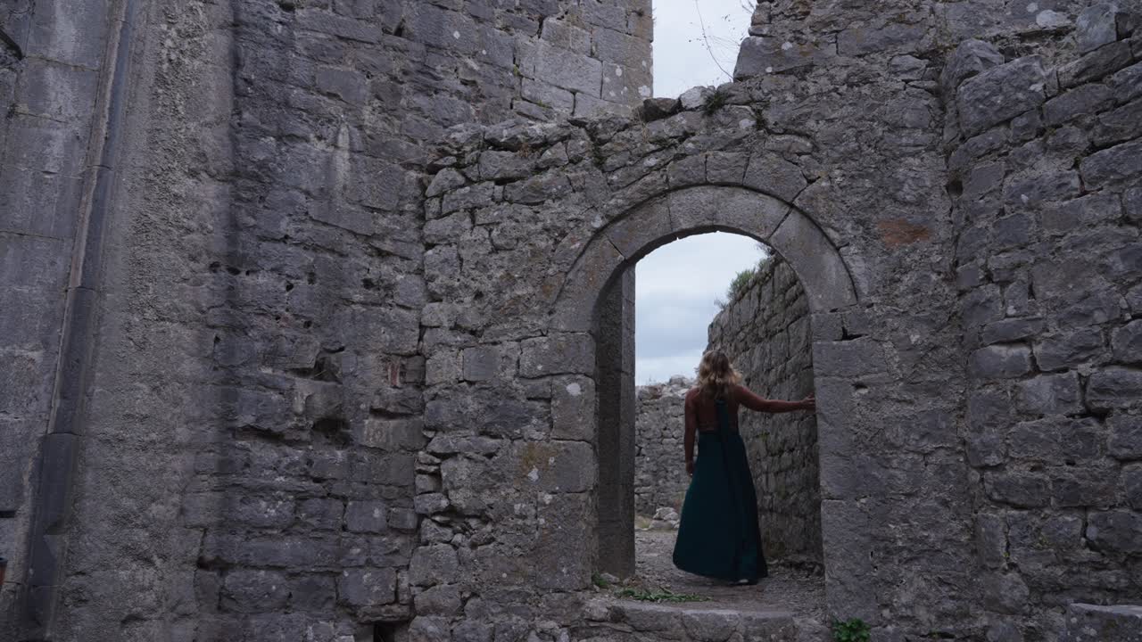Woman in dress walking through Rozafa Castle in Albania