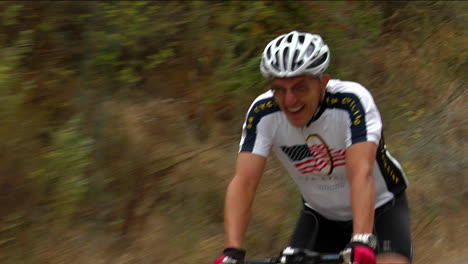 a bicyclist pedals hard in a rural road race