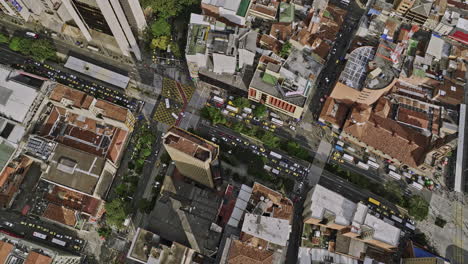 medellin colombia aerial v49 birds eye view flyover the intersection between ave oriental and calle 52 in la candelaria, tilt up reveals downtown cityscape - shot with mavic 3 cine - november 2022