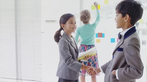 Kids-as-business-people-shaking-hands-4k