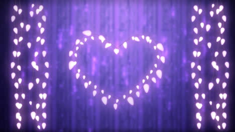 glowing heart and strings of fairy lights on purple background