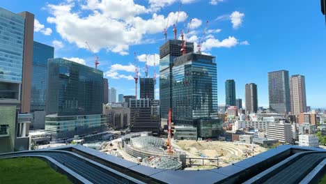 Revealing-shot-of-multiple-cranes-helping-build-the-Umekita-underground-train-station