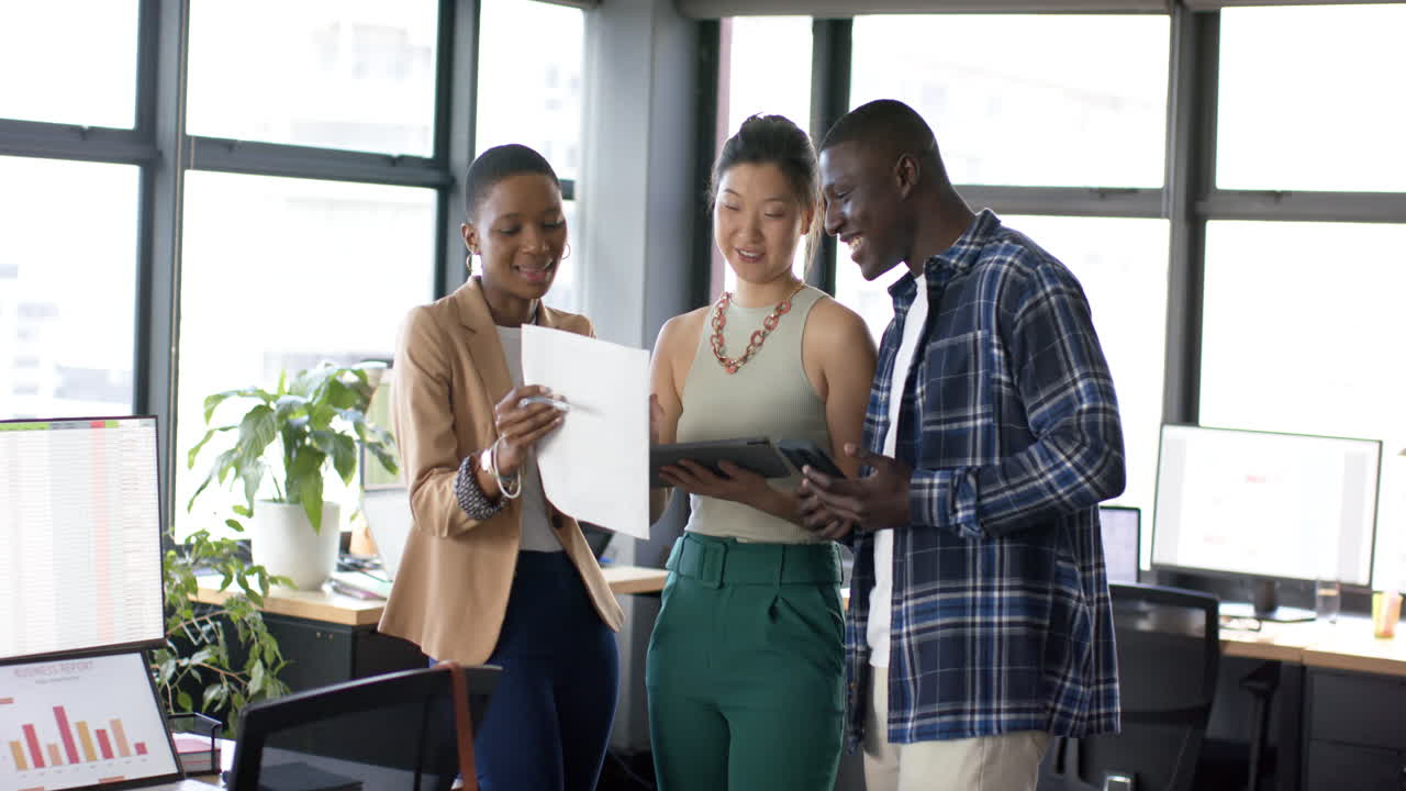 Diverse business people talking and working together in office, slow motion, copy space