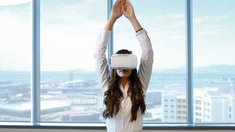 Female-executive-using-virtual-reality-headset