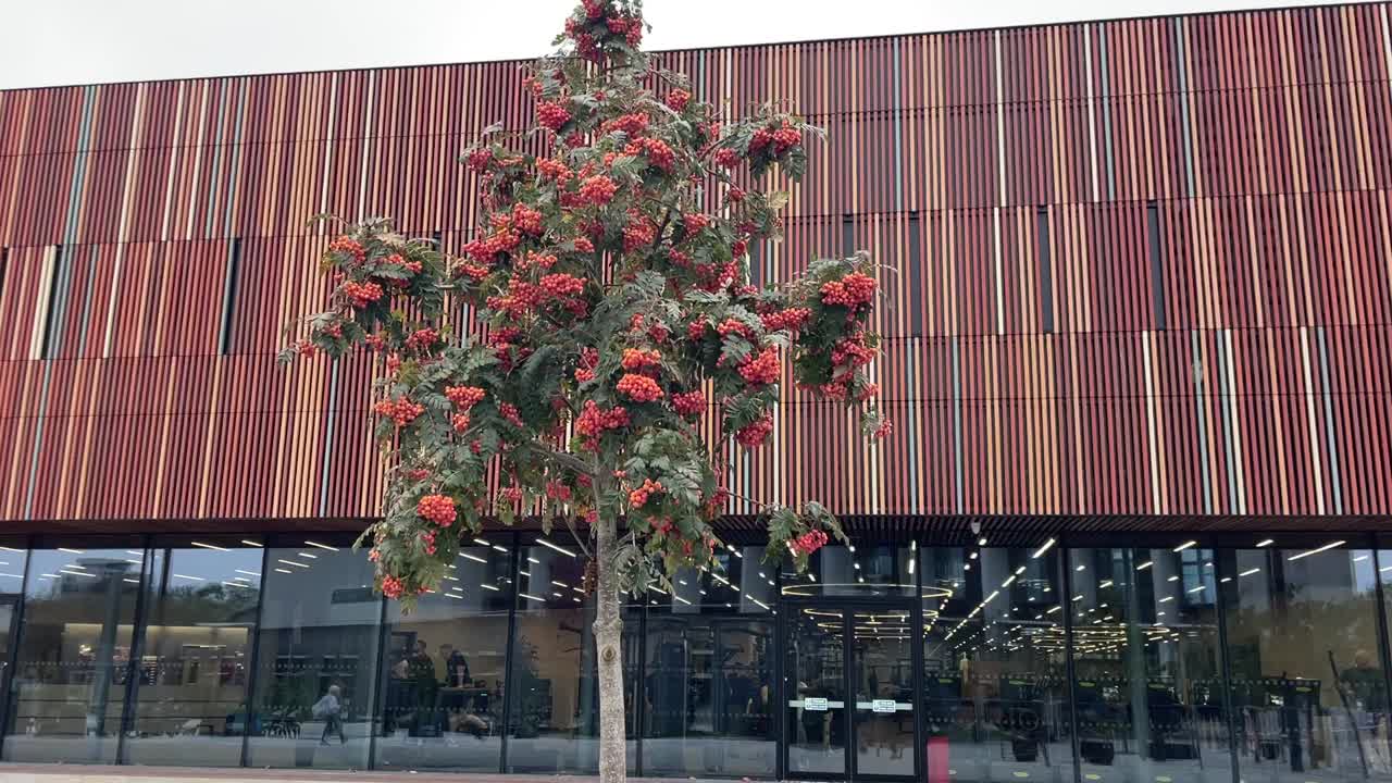 Modern brick sports center with decorative fencing near Gunwharf Quay in Portsmouth.