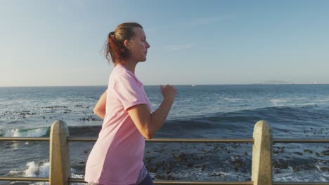 senior woman running on a promenade