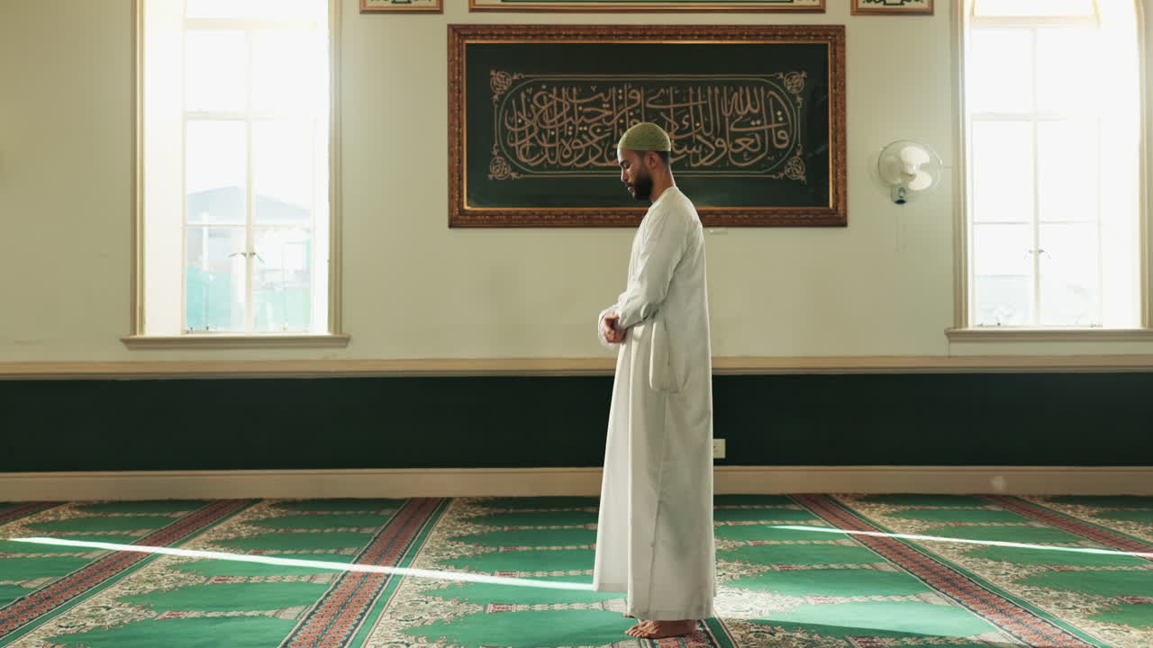 A Muslim man praying in a mosque