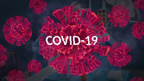 Animation-of-covid-19-text-and-cells-over-surgeons-in-face-masks