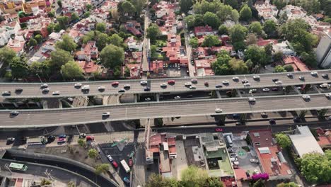 Slow-motion-aerial-view-of-expressways-in-western-Mexico-City