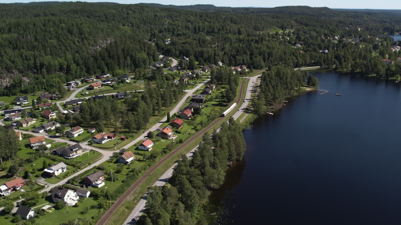 Långbrons slusstation and a peaceful village in Dals Långed by a serene lake