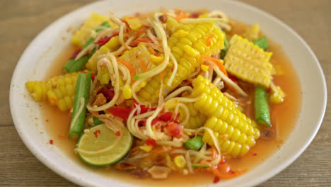 som tum - thai spicy papaya salad with corn - asian food style