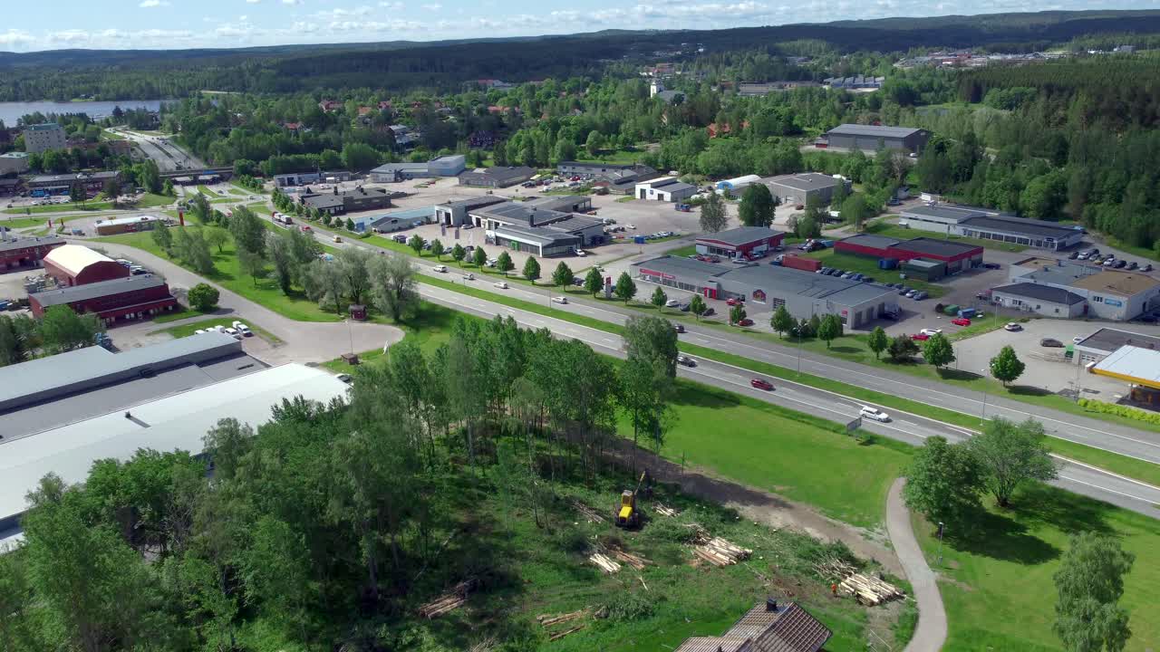 Flying Over Construction Site Towards Industrial Area, Sweden, Aerial