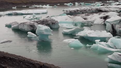 melting iceberg in jökulsárlón glacier lagoon in iceland - wide shot