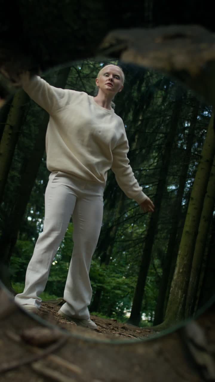 Woman in White Reflected in Forest Mirror