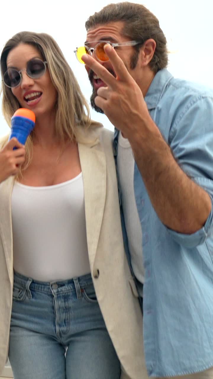 Group of friends having fun singing with a toy microphone