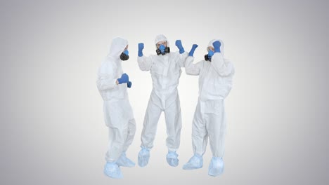médicos en trajes de hazamat apilando manos trabajo en equipo en fondo de gradiente