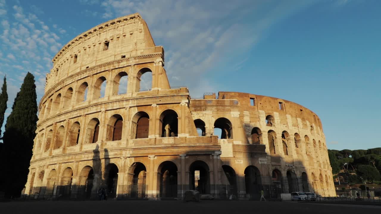 Rome's world classic Famous monument the Colosseum. Golden hour blue sky.
