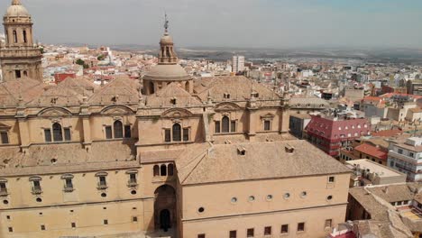 Spain-Jaen-Cathedral,-Catedral-de-Jaen,-flying-shoots-of-this-old-church-with-a-drone-at-4k-24fps-using-a-ND-filter-also-it-can-be-seen-the-old-town-of-Jaen