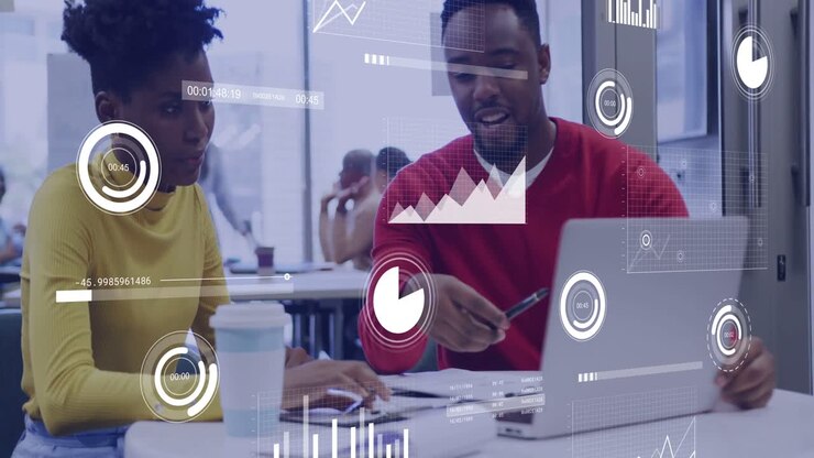 Man gesturing with pen at laptop and woman typing, reviewing business HUD charts confirming details