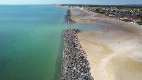 rock barrier and navigation marker at elmer sand beach near middleton on sea, bognor regis, west sussex, uk