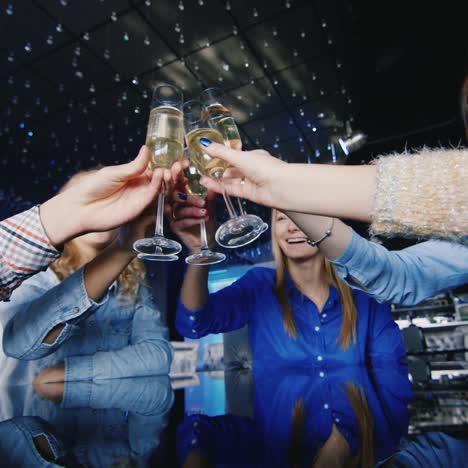 a group of young people have fun at a table in the club 4