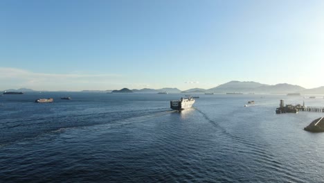 roro roll on-off vessel cruising slowly leaving hong kong bay