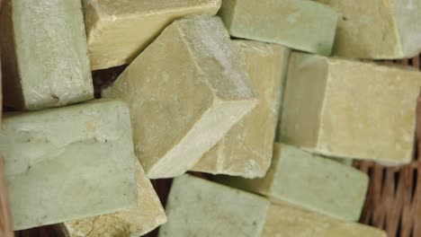 assorted bars of natural soap in a basket