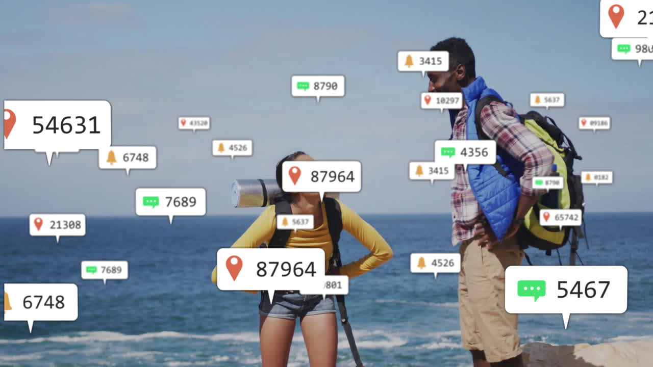 Two backpackers exploring cliff by ocean, showing floating notification icons for travel tech