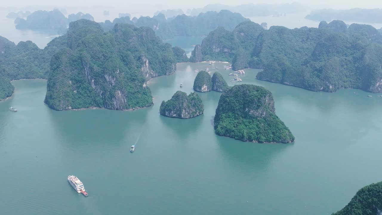 River winding through lush limestone cliffs in Ha Long Bay, peaceful and scenic view