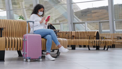 woman waiting at airport/train station