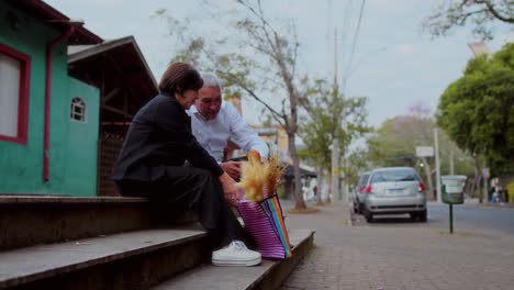 elderly couple's affectionate moments on city steps