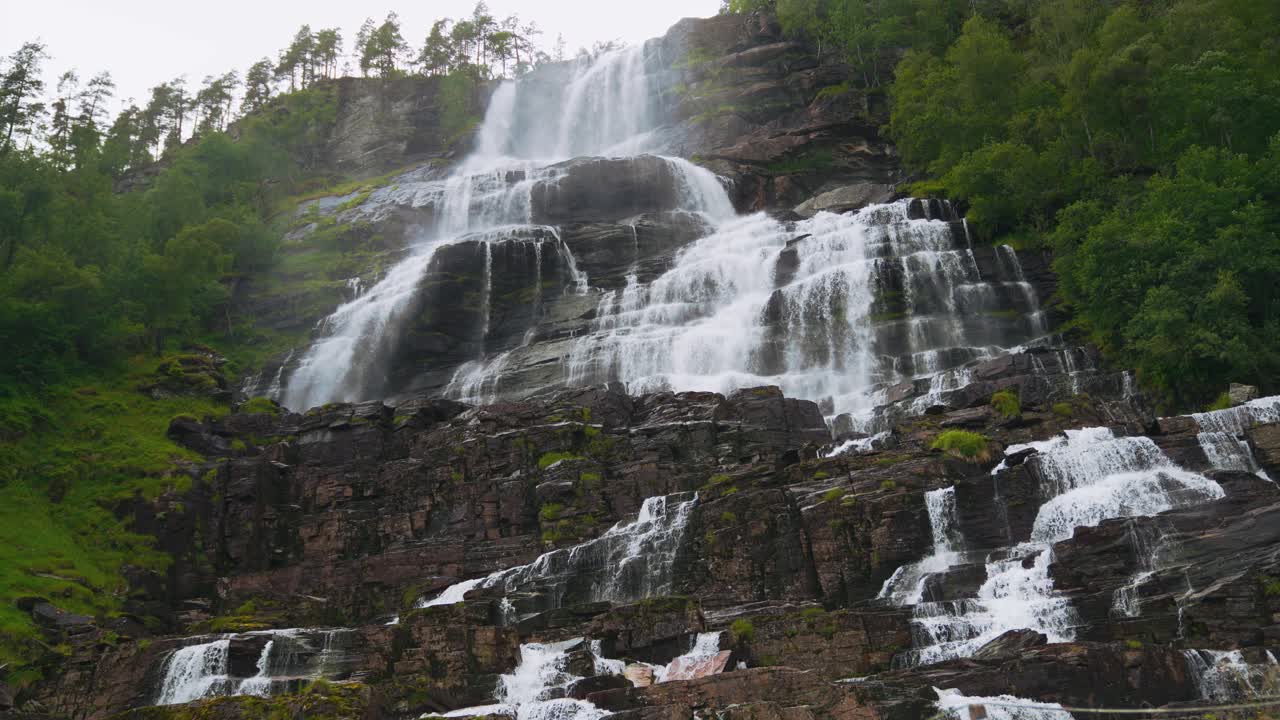 Majestic Waterfall cascading down rocky mountainside