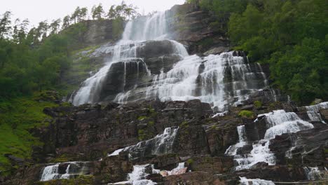 majestic waterfall cascading down rocky mountainside