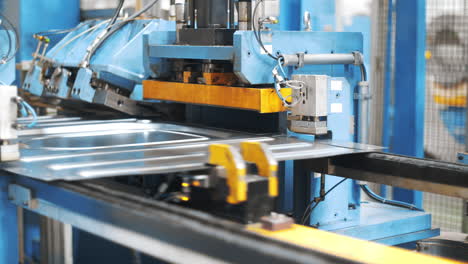 Automatic conveyor line manufacturing metal detail. Production washig machine