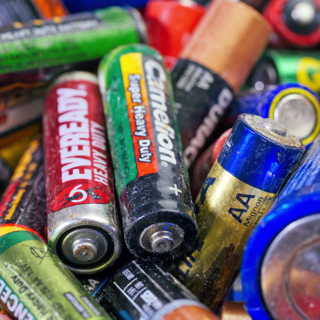 A Lot Of Used Alkaline Batteries For Recycling. Waste, collection and recycling, high danger for the environment