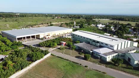 180 plane wraparound drone moving towards an industrial factory in the countryside, concept of industrial enterprises outside the city